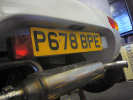 Revised number plate mounting